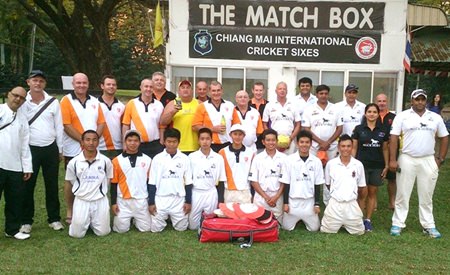 Pattaya Cricket Club players pose with the Lanna C.C. team at the Gymkhana ground in Chiang Mai, Feb. 15.