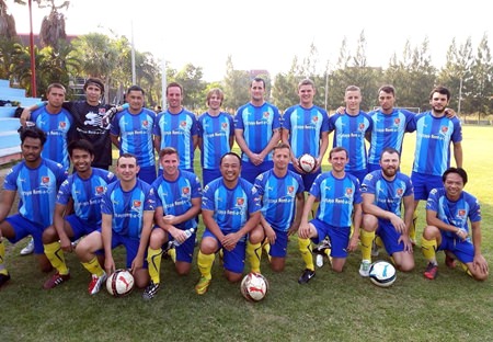The massed ranks of the Pattaya City football team line up prior to their match against Bangkok FC at the Laem Chabang Arena.
