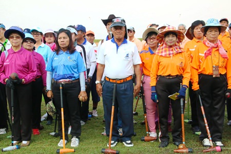 Competitors line up for the seniors woodball tournament at the Nawikayothin Headquarters in Sattahip on Saturday, Feb. 7.
