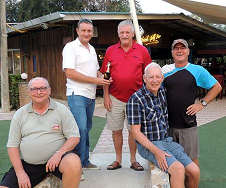 John Player (centre) is presented the trophy by Greg Hirst of DeVere with Andy Makara (seated left), John Stafford (seated right) and Kim Danboise.