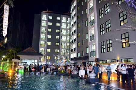 Guests enjoy the atmosphere poolside at Na Lanna during the project’s opening party.