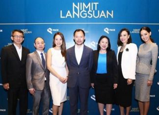 Sorapoj Techakraisri (centre), CEO of PACE Development Corp., stands with fellow company directors and management during the announcement of the Nimit Langsuan project in Bangkok, Feb. 26, 2015.