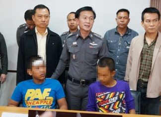 Two of the four accused rapists are brought out for the press.