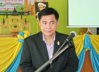 Pakasit Suksongkram, Phanat Nikom’s deputy district chief, presides over the meeting with civil servants and village chiefs.