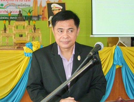 Pakasit Suksongkram, Phanat Nikom’s deputy district chief, presides over the meeting with civil servants and village chiefs.