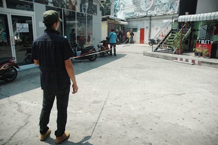 Officials from the Technician Office measure the area to determine the boundary of the public canal. Anything inside the boundary must go.