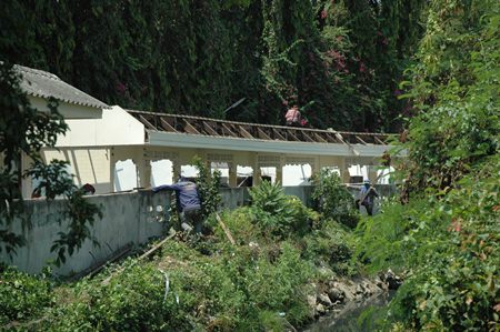 City workers tear down rental rooms caught trespassing and blocking the South Pattaya canal.