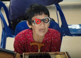 Riam Saengo, 89, has an eye exam because she cannot see her TV programs clearly.