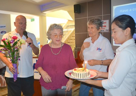 Marjorie looks on with surprise at the birthday cake prepared for her as Club Chairman Roy Albiston prepares to present her with a bouquet of flowers in honor of her 88th birthday. Marjorie is a long time member of the PCEC and served on its Governing Board from 2008 to 2010.
