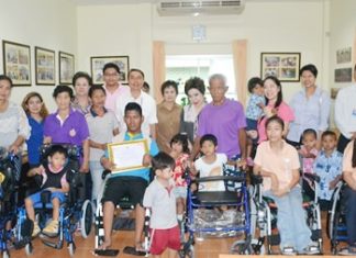 Representatives from the TISCO Foundation donate prosthetics to the Father Ray Foundation.