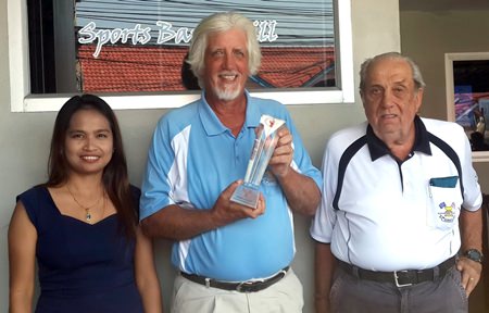 Jimmy Little (centre) celebrates winning his first ever monthly golf tournament.