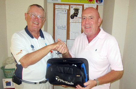 Dick Warberg (left) presents the MBMG Golfer of the Month award to Mike O’Brien.