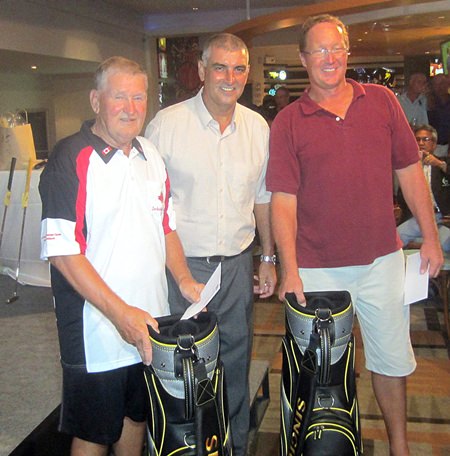 PSC Golf Chairman Mark West (centre) presents prizes to tournament winners Daryl Tomlinson & Darren Zuidema.