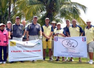 Tournament organizers, players and caddies pose for a group photo at Burapha Golf Resort.