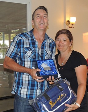 Ed Butcher of the APT Group receives his prize from the only lady on the tour, Karen.