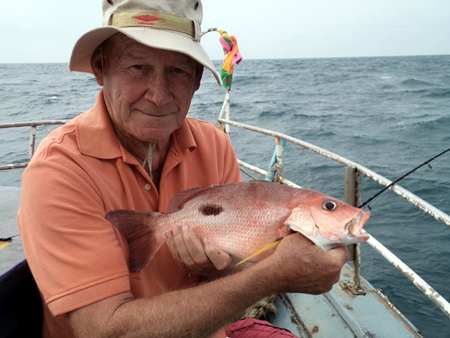 John shows off his prize catch.
