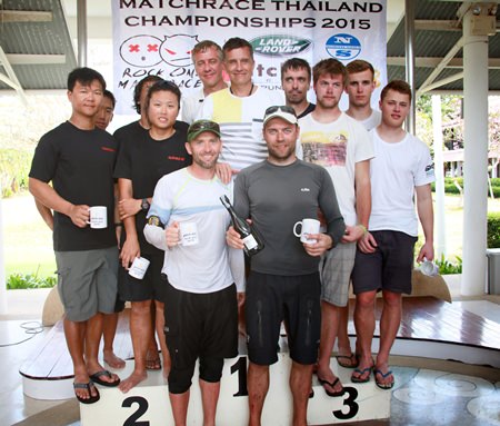 The top three teams, representing Estonia, Singapore and Finland, squeeze onto the podium.