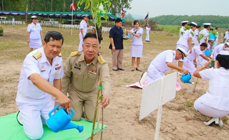 Vice Adm. Wipak Noyjinda helps plant one of the 1,600 Siamese Rosewood trees to honor HRH Princess Sirindhorn for her 60th birthday.