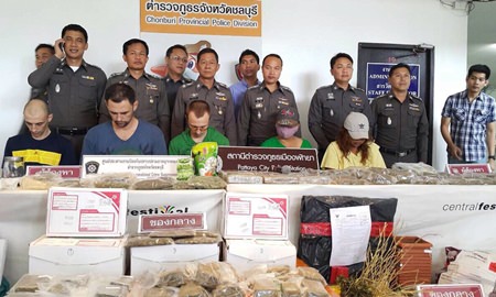 Police bring out for the press the 5 accused drug dealers.