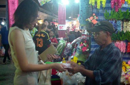 Local market vendor Somai Jaiyangyuen (right) says improvements after the lifting of martial law will take time.