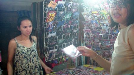Wandee Jaemsawang (left), a DVD/VCD vendor of Wat Chaimongkol Market, said her business is not improving since the lifting of martial law.