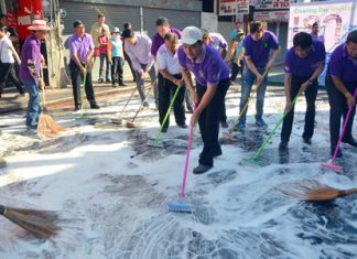Mayor Itthiphol Kunplome leads local leaders and city workers in scrubbing down Walking Street.