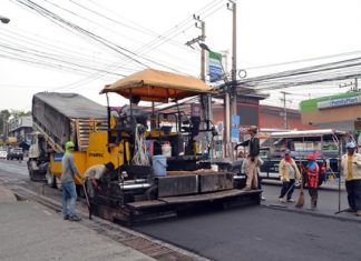 Contractors laying asphalt on Pattaya 2nd Road in North Pattaya hope to be finished before the Songkran Festival.