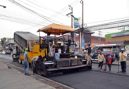 Contractors laying asphalt on Pattaya 2nd Road in North Pattaya hope to be finished before the Songkran Festival.