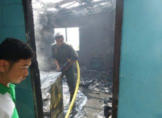 Fire police extinguish the final embers after the conflagration destroyed the house of a 104.75 radio technician on Pratamnak Hill.