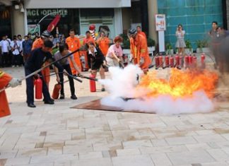 Fire police officers provide basic fire fighting training to employees of the Central Festival Pattaya Beach.