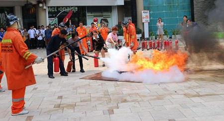 Fire police officers provide basic fire fighting training to employees of the Central Festival Pattaya Beach.