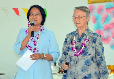 Sister Jiemjit Thumpichai and Sister Joan Gormley welcome guests to the Songkran activities at the Fountain of Life Center Pattaya.