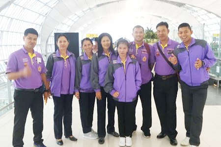 Members of the Coco Club bowls team pose for a photo on their way to Singapore. In photo are Bus, On, Sue, Thong, Thanom, Num, Vinai and Go.