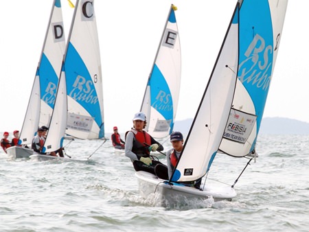 Student sailors battle for honours in RS Quba dinghies during the team racing category.
