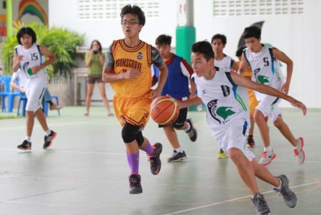 Basketball players in action at the U13 FOBISIA Games held at GIS from March 12-15.