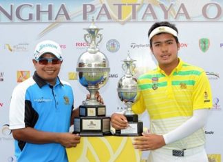 Prayad Marksaeng (left) and 16-year old amateur golfer Suradit Yongcharoenchai (right) pose with their trophies at the conclusion of the 2015 Singha Pattaya Open at Burapha Golf Club, Sunday, March 29.