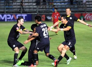 Pattaya United players congratulate Wattana Plainum (2nd left) after he opened the scoring against Chiang Mai FC in their Division 1 fixture at the Nongprue Stadium in Pattaya on April 8.