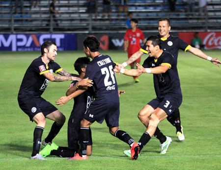 Pattaya United players congratulate Wattana Plainum (2nd left) after he opened the scoring against Chiang Mai FC in their Division 1 fixture at the Nongprue Stadium in Pattaya on April 8.