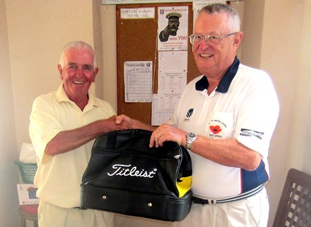 Dick Warberg (right) congratulates Dave Cooper – the MBMG Group Golfer of the Month.