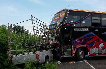 The driver and passenger were injured when their pickup was struck by a tour bus in Huay Yai.