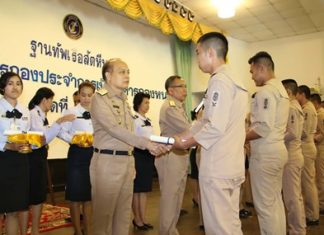 Navy discharges 112 sailors Rear Adm. Chatchawal Meesawad presents a certificate to one of 112 outgoing seamen at Sattahip Naval Base.