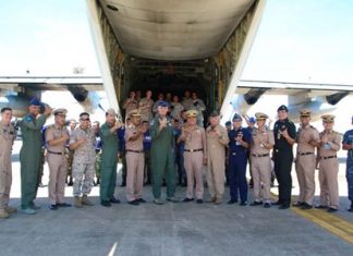 U.S. Air Force Brig. Gen. Michael Minihan (center left) and Royal Thai Navy Rear Adm. Graisrl Gesom (center right) visit the site of the pallet load and thank everyone involved with the mission.
