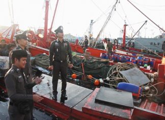 Marine Police inspect fishing boats at Sattahip’s Samae San pier as part of Thailand’s rush to comply with European Union standards to avoid a ban on Thai seafood.