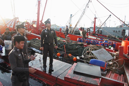 Marine Police inspect fishing boats at Sattahip’s Samae San pier as part of Thailand’s rush to comply with European Union standards to avoid a ban on Thai seafood.