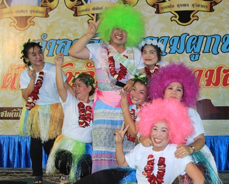 Father Phu with a green wig and his dancers.