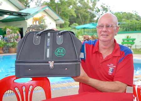 Brian Parish shows off one of the bags that all the players received from Gary Rogers.