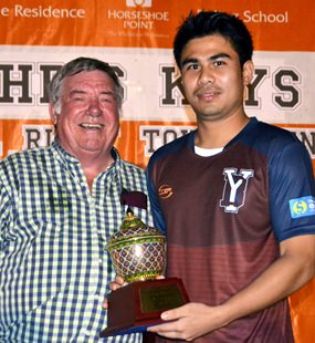 Ray Kays (left) presents the Bowl to the captain of the Young Blood team.