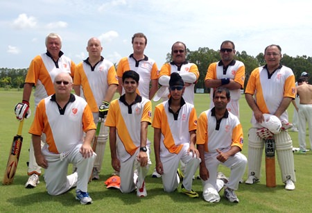 Pattaya Cricket Club Thoroughbreds line up for their match against the British Club of Bangkok at the Thai Polo Ground in Pattaya, Sunday, May 24.