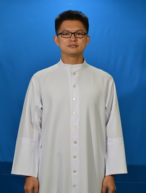 Fr. John in his official pose as a priest.