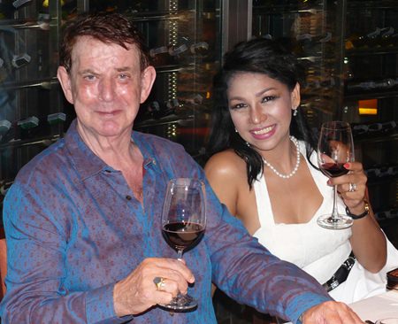 Dr William van Ewijk and Sonia sample the wine.